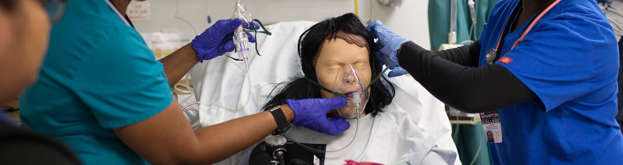 nursing students training with a dummy patient